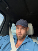 Adam wearing the EVD 5-Panel Short Brim Cap in Blue / White