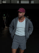 Adam wearing the EVD 5-Panel Short Brim Cap in Berry / White