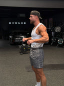 Adam wearing the EVD 5-Panel Short Brim Cap in Faded Black / Pink, backwards